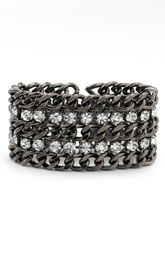 RJ Graziano 's cuff made out of white metal and austrian crystals look over the top expensive , but is not a day into night piece avaiable at Nordstroms
